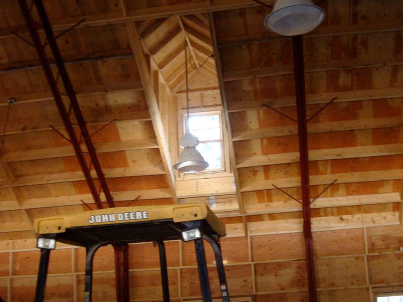 Interior view of trusses in a hybrid wood and steel buildings by Steel Bolt Construction